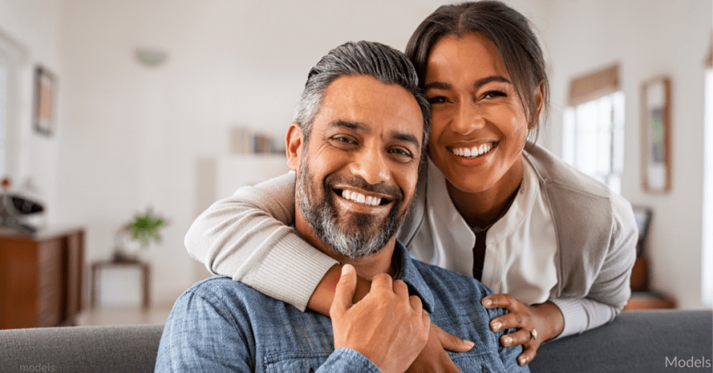 a couple smiling after a satisfying sexual intercourse resulting from the man's use of proenhance penis enhancement patch