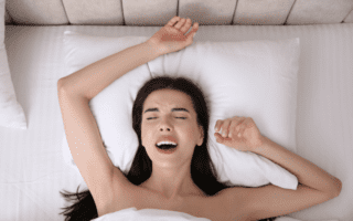 woman having orgasm in bed