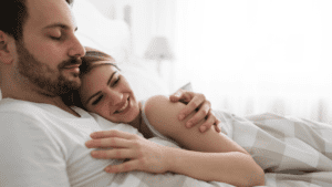 The man used male enhancement creams to boost his sexual prowess. Now he is in bed with his female partner and both of them seem to be satisfied with their intercourse